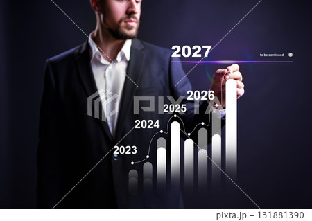 Businessman presents growth projections for the upcoming years in a corporate setting Businessman presents growth projections for the upcoming years in a corporate setting 131881390
