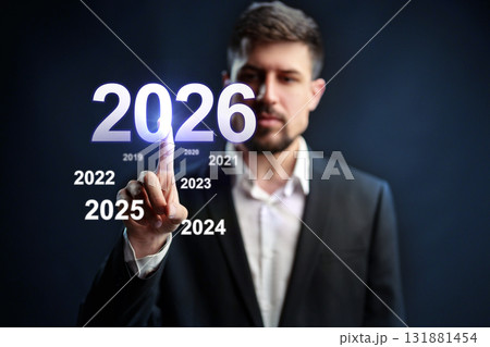 Man interacting with futuristic display showing years from 2019 to 2026 131881454