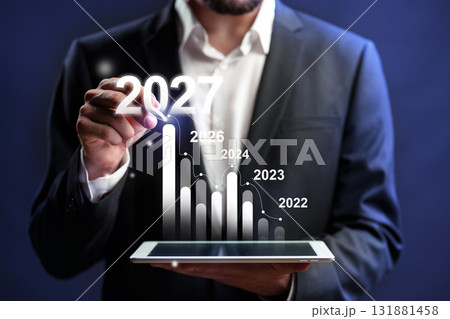 Business professional analyzing growth trends for future planning through digital graphs 131881458