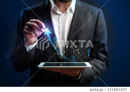Business professional analyzing data trends on a digital tablet in a modern setting Business professional analyzing data trends on a digital tablet in a modern setting 131881507