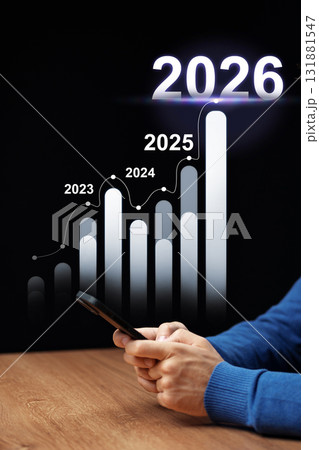 Growth projections and trends: a person analyzing data for upcoming years 2023 to 2026 131881547