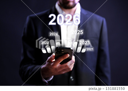 Future planning with a smartphone in a formal setting, focused on upcoming years Future planning with a smartphone in a formal setting, focused on upcoming years 131881550
