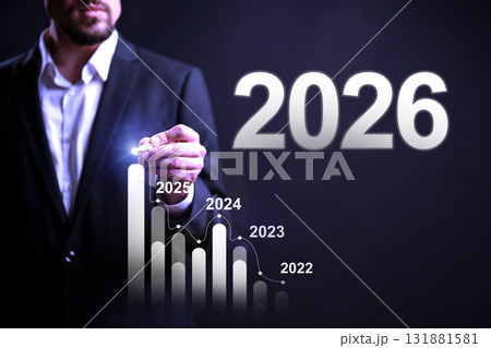 Business professional analyzing growth trends for future years in a dark setting 131881581