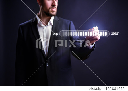 Business professional making projections from 2026 to 2027 with digital interface 131881632