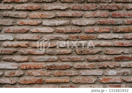 Textured brick wall with a blend of red and white bricks showcasing an rustic urban aesthetic 131881932