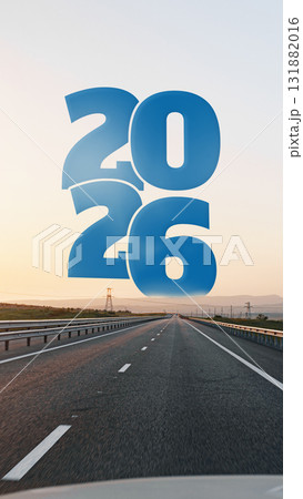 Road stretches towards horizon with bold 2026 overlay at sunset Road stretches towards horizon with bold 2026 overlay at sunset 131882016