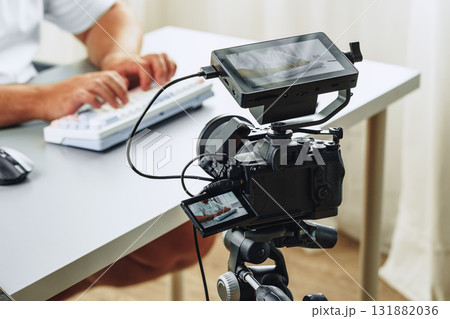 Camera setup for video recording in a home office during a remote work session Camera setup for video recording in a home office during a remote work session 131882036