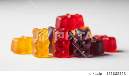 Group of red, orange and purple multivitamin gummies bears isolated on white background. Healthy lifestyle concept Group of red, orange and purple multivitamin gummies bears isolated on white background. Healthy lifestyle concept 131882368