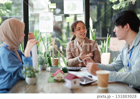 Empowering Sustainable Practices. A team discusses sustainable architecture and renewable energy solutions. Empowering Sustainable Practices. A team discusses sustainable architecture and renewable energy solutions. 131883028