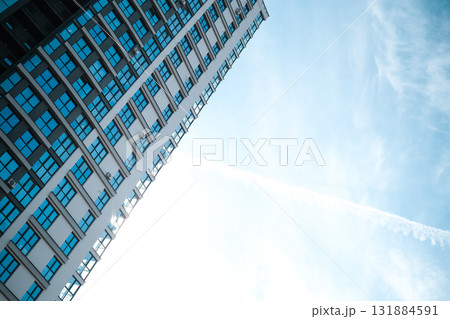 Multi-storey building on the background of blue sky. High quality photo 131884591