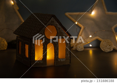 Cardboard paper Lantern House Sustainable Christmas preparation Diy handmade house. Step by step activity for children. Inclusive and responsible stress relief holiday hobby Cardboard paper Lantern House Sustainable Christmas preparation Diy handmade house. Step by step activity for children. Inclusive and responsible stress relief holiday hobby 131886188