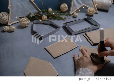 Cardboard Lantern handmade house Storytelling creating craft Christmas holiday decoration. Tactile hand-on activity. Master class progress of creative me-made gifts. Seasonal domestic life micro 131886191