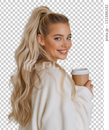 Young woman with long blonde hair wearing cozy sweater holding takeaway coffee cup smiling warmly 131886282