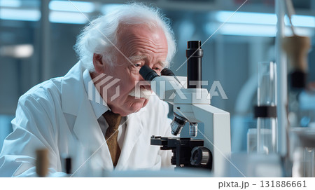 Elderly scientist in white lab coat looking through microscope in modern laboratory, focused and contemplative expression 131886661
