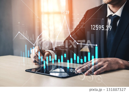 Businessman analyzes financial data on tablet with graphs and charts, showcasing trends and market performance in a modern office setting Scalp Businessman analyzes financial data on tablet with graphs and charts, showcasing trends and market performance in a modern office setting Scalp 131887327