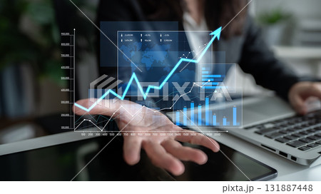 Business Professional Shows Data Visualization and Graphs on Digital Screen with Growing Arrow to Indicate Financial Success and Market Trends Scalp Business Professional Shows Data Visualization and Graphs on Digital Screen with Growing Arrow to Indicate Financial Success and Market Trends Scalp 131887448