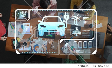 Top View of Diverse Team Collaborating on Electric Vehicle Development with Digital Overlays and Innovative Technology Visuals. Raster 131887478