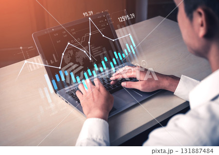 Business professional analyzing financial data with laptop, charts, graphs, and numbers reflecting market trends and performance metrics in modern workspace Scalp 131887484