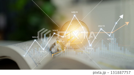 Light Bulb on Open Book with Financial Charts, Data Visualization, and Growth Indicators Representing Knowledge and Innovation in Business Strategies Scalp 131887757