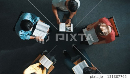 Top down view of prayer reading at bible book and sitting in circle. Symposium. Top down view of prayer reading at bible book and sitting in circle. Symposium. 131887763