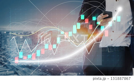 Businessman Using Smartphone for Stock Market Analysis with Graphs and Financial Data in Modern City Background at Dusk Copula 131887867