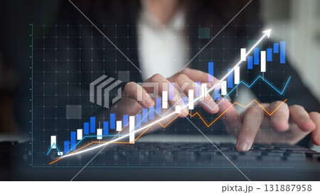 Businesswoman Analyzing Data Trends on Computer with Financial Graphs and Statistics, Focusing on Growth and Market Performance Indicators Copula 131887958