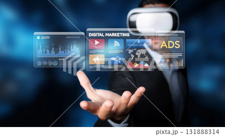 Futuristic Businessman Exploring Virtual Reality Applications in Digital Marketing with Transparent Data Interfaces and Graphical Elements. Raster Futuristic Businessman Exploring Virtual Reality Applications in Digital Marketing with Transparent Data Interfaces and Graphical Elements. Raster 131888314