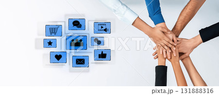 Diverse Hands Coming Together with Digital Icons Representing Collaboration, Communication, Business, and Social Media in a Modern Workplace Environment Trope Diverse Hands Coming Together with Digital Icons Representing Collaboration, Communication, Business, and Social Media in a Modern Workplace Environment Trope 131888316