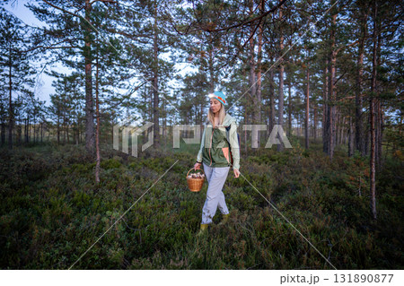 Happy tired middle-aged woman forager enjoying final moments of long day satisfying seasonal hobby 131890877