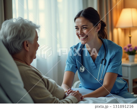 Happy Nurse Comforting a Smiling Elderly Patient by Gently Holding Hands in a Warm Hospital Setting Happy Nurse Comforting a Smiling Elderly Patient by Gently Holding Hands in a Warm Hospital Setting 131891216