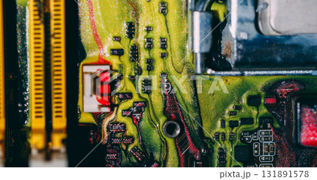 Ink spill. Processor chip. Defocused yellow blue red color digital motherboard acrylic glitter liquid on abstract electronic background. 131891578