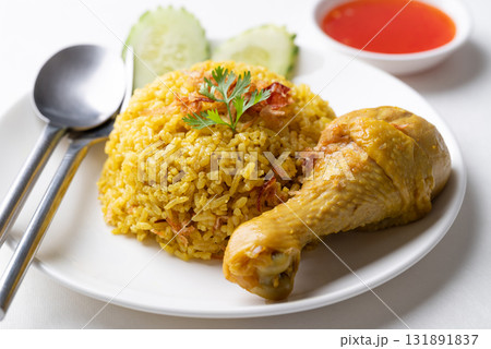 Thai Biryani rice with chicken and chili sauce on white background 131891837
