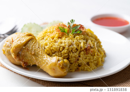 Thai Biryani rice with chicken and chili sauce on white background Thai Biryani rice with chicken and chili sauce on white background 131891838