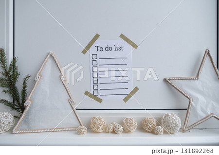 Paper note with inspirational TO DO CHECLIST with natural zero waste homemade Christmas decor. Happy new year promises resolutions. Self growth and personal development Paper note with inspirational TO DO CHECLIST with natural zero waste homemade Christmas decor. Happy new year promises resolutions. Self growth and personal development 131892268