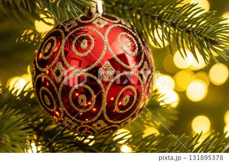 Red Christmas Ornament with Golden Pattern on Tree Red Christmas Ornament with Golden Pattern on Tree 131895378