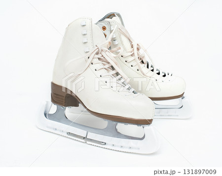 Skates in a cover on a white isolated background Skates in a cover on a white isolated background 131897009
