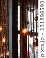 festive interior design featuring decorative ropes and hanging lights in cozy urban space. closeup. 131898593