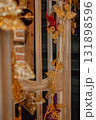decorative golden ornaments and plants adorn wooden display in festive setting. closeup. 131898596