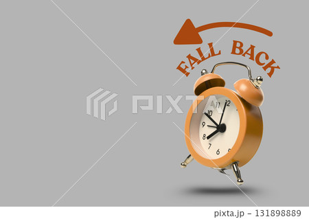 Orange clock with white face and black numbers 131898889
