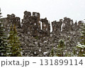 Snowing at the unique formation with boulder rocks in mountains in fall. 131899114