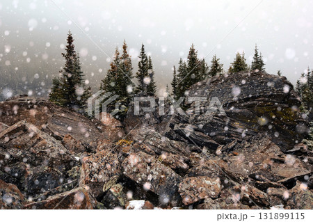 Snowing at the unique formation with boulder rocks in mountains in fall. Snowing at the unique formation with boulder rocks in mountains in fall. 131899115