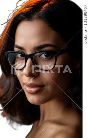 A Latina woman with a chic bob and bold glasses, her face illuminated by warm, glowing lines, symbolizing creativity, focus 131899457