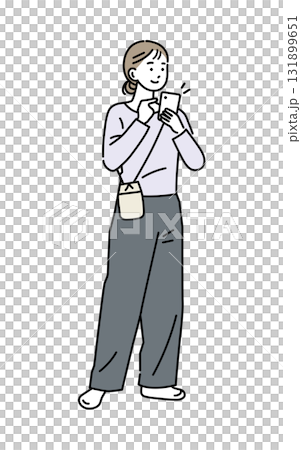 A woman holding and operating a mobile phone 131899651