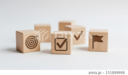 Business success concept with key element for goal achievement on white background. Wood block with target, check mark and milestone icon for strategic planning 131899998