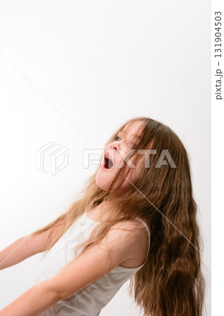 Young girl with long brown hair looking up in surprise. Young girl with long brown hair looking up in surprise. 131904503