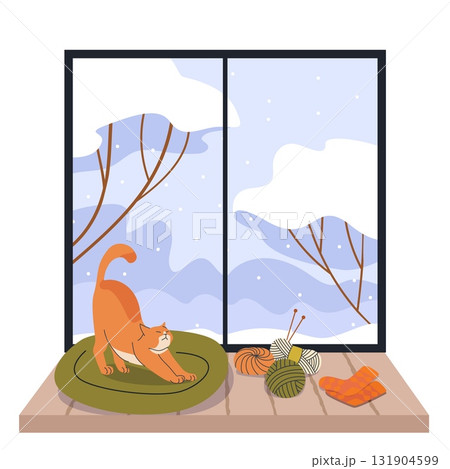 Cozy orange cat stretching on cushion by snowy window with yarn balls knitting needles and warm socks winter home interior scene Cozy orange cat stretching on cushion by snowy window with yarn balls knitting needles and warm socks winter home interior scene 131904599