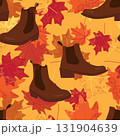 Seamless pattern with brown leather boots and autumn maple leaves in warm fall colors on yellow background for seasonal fashion and textile designs 131904639