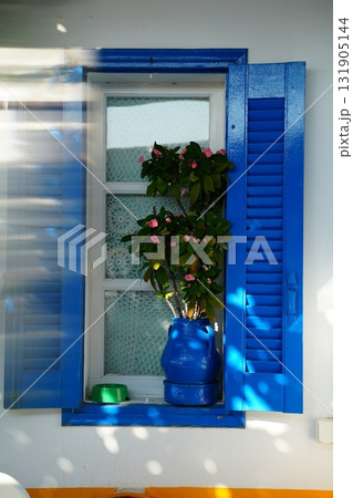 Blue Window Shutters with Pink Flowers in Blue Vase 131905144