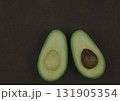 Avocado fruit two halfes on green background. Green avocado, minimal flat lay style with copy space. 131905354