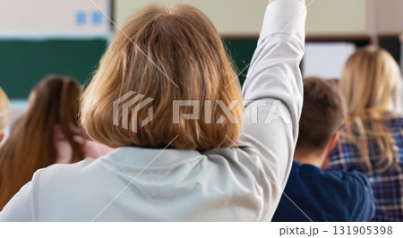 Back view of older student raising his hand to answer teacher's question during education training class. jpg ai image 131905398
